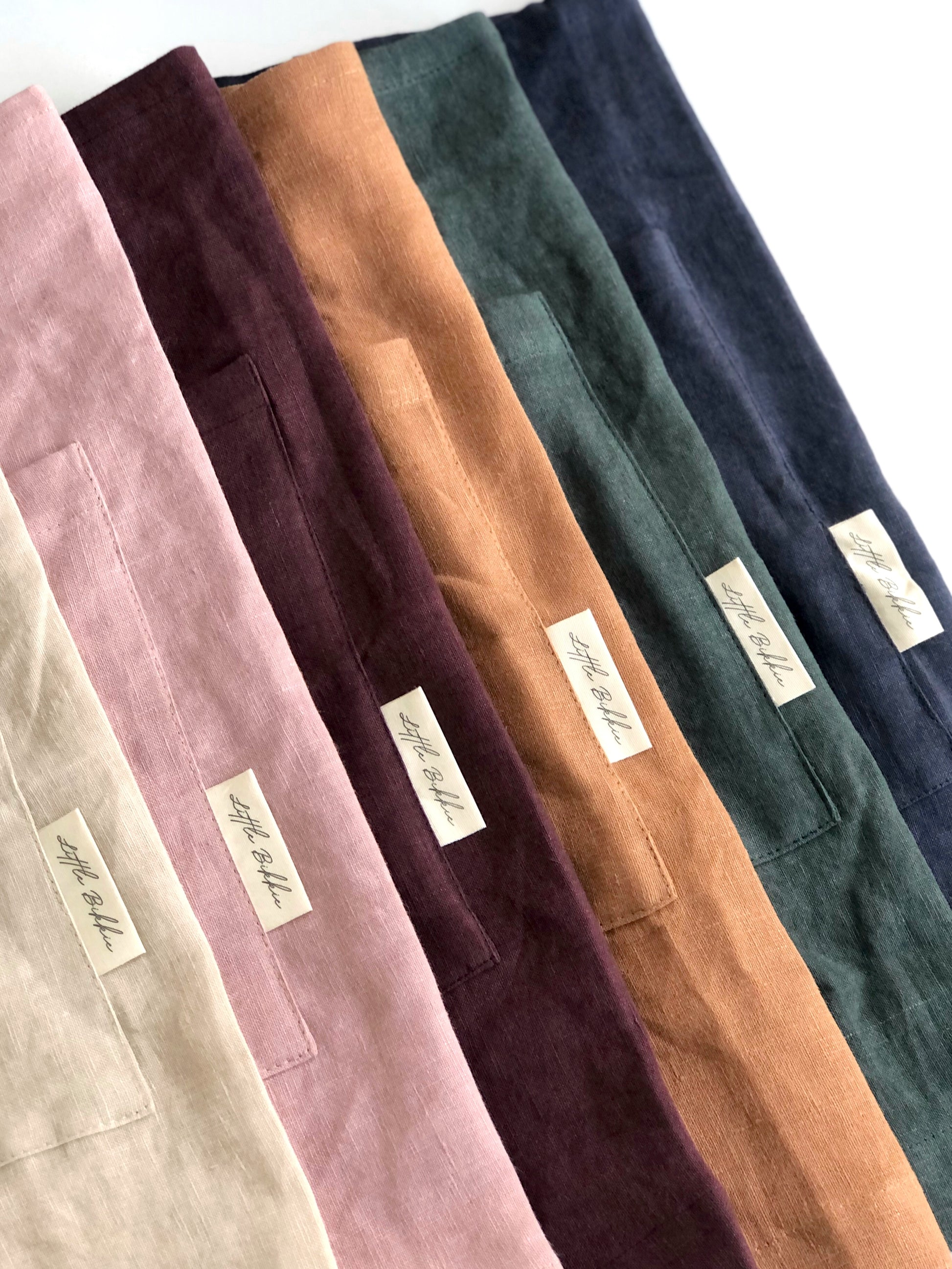 100% linen half waist apron. Large front pocket. Long ties can be fastened at the back or at the front, creating a large bow. Multiple colour ways.