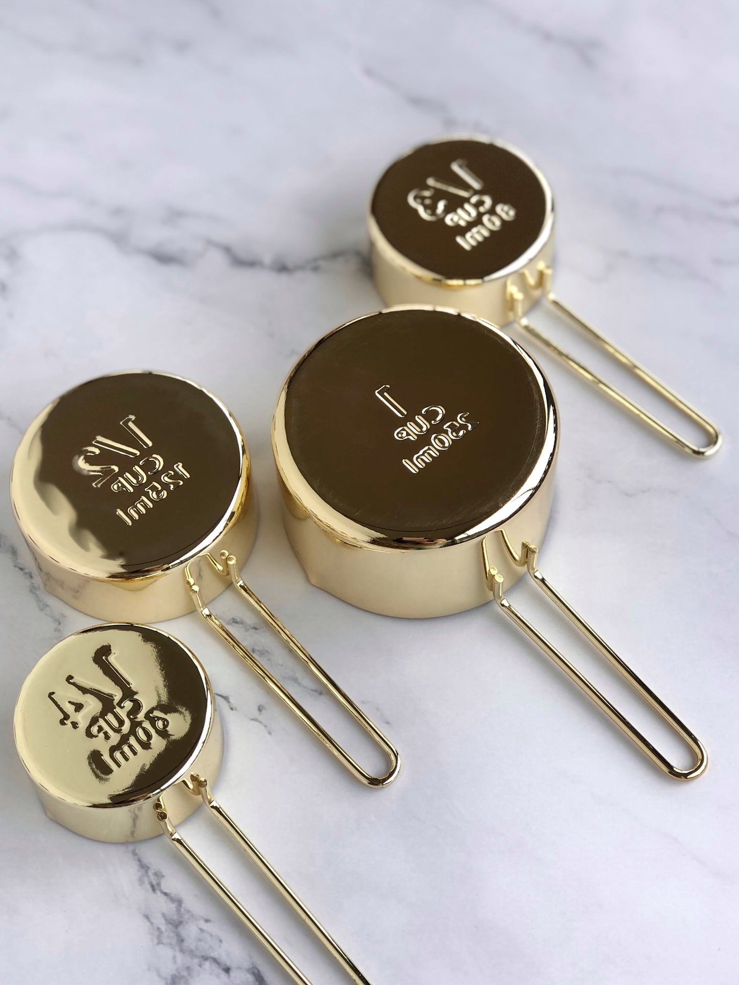 Gold measuring cups. Bottom view