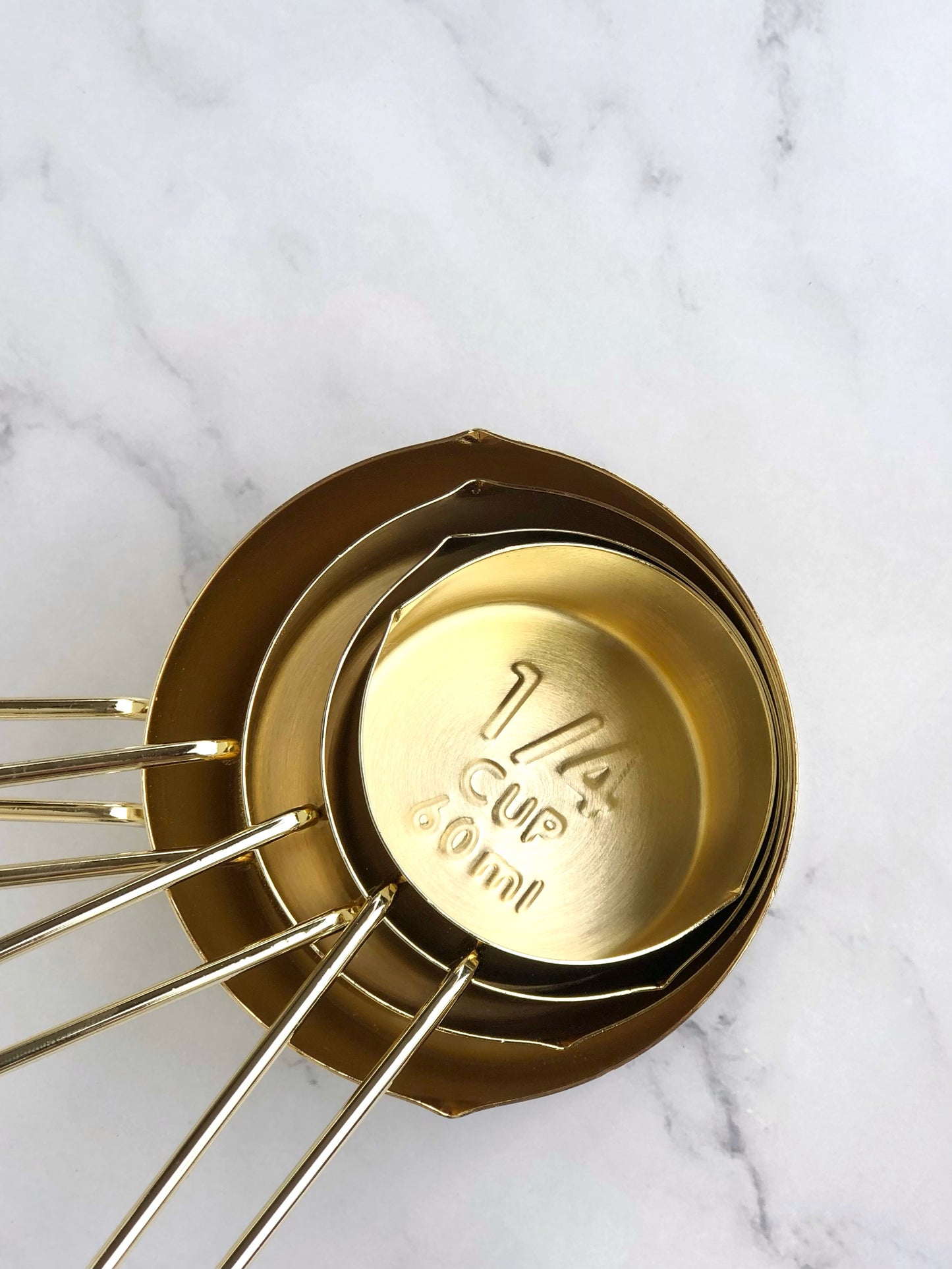 Gold measuring cups. Top view