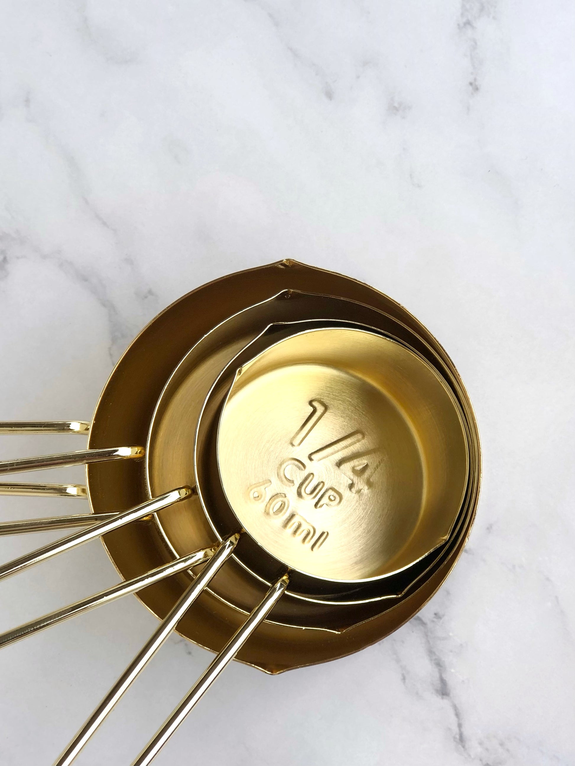 Gold measuring cups. Top view